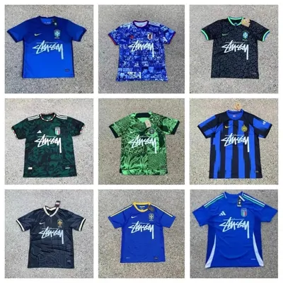 Football shirts in blue, green, black and red laid out in a grid