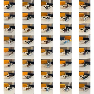 A grid of several dozen pairs of sunglasses laid out on a white surface, each beside an orange case